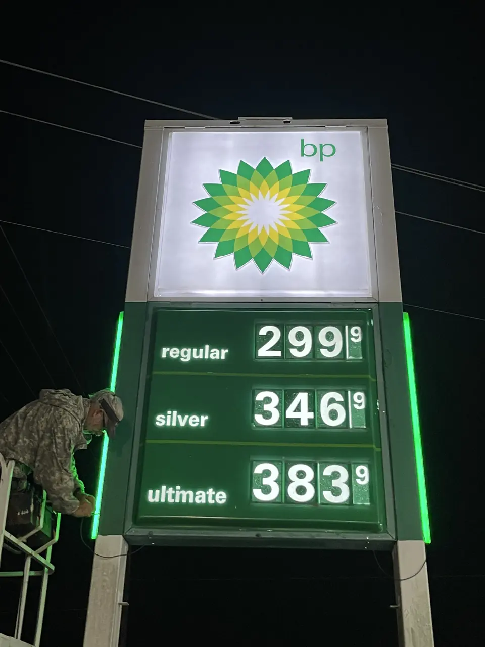 Large BP gas station pole sign with pricing cabinet visible from the highway.