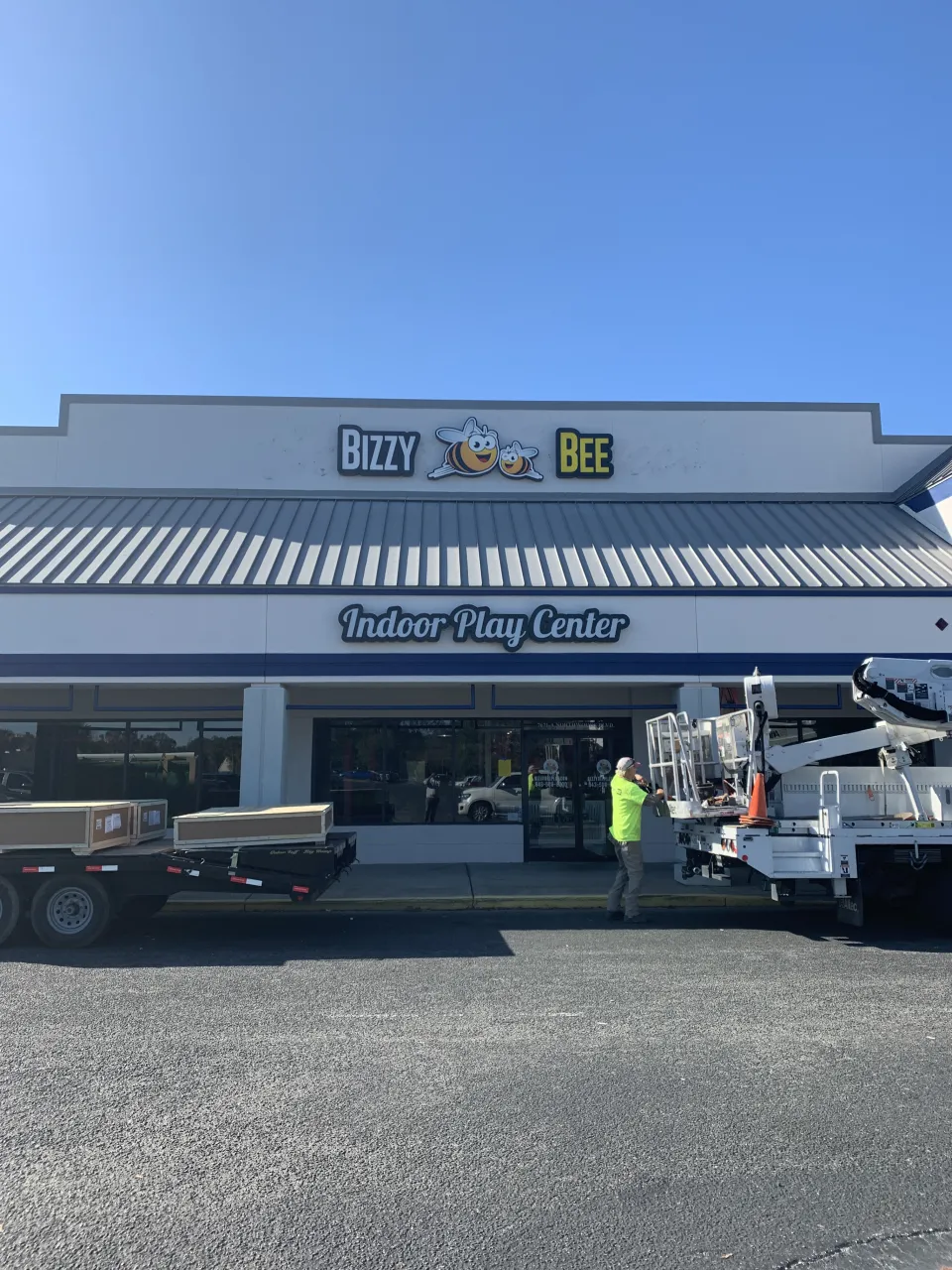Bizzy Bee Indoor Play Center storefront sign above the entrance.