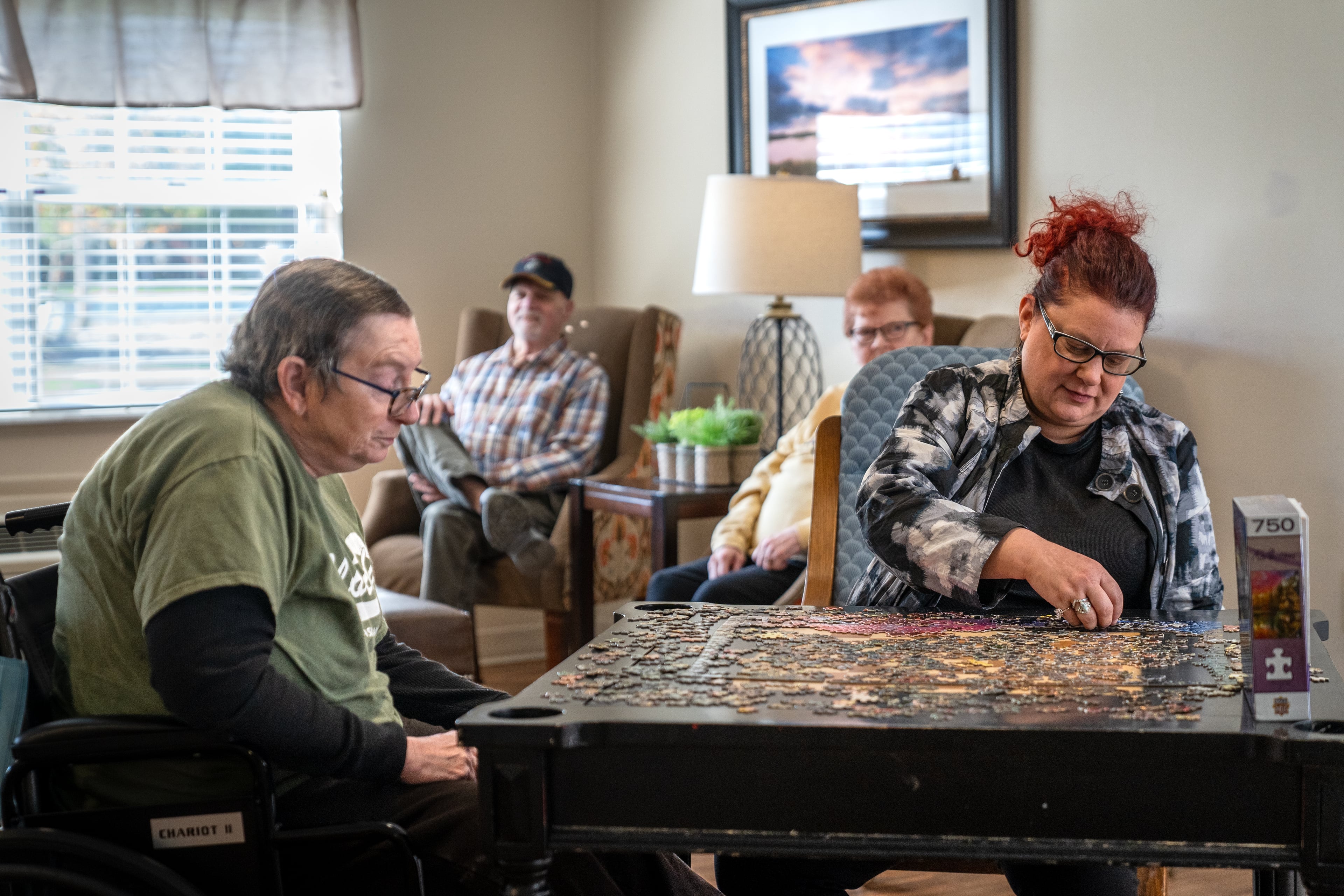 Residents working on a puzzle together