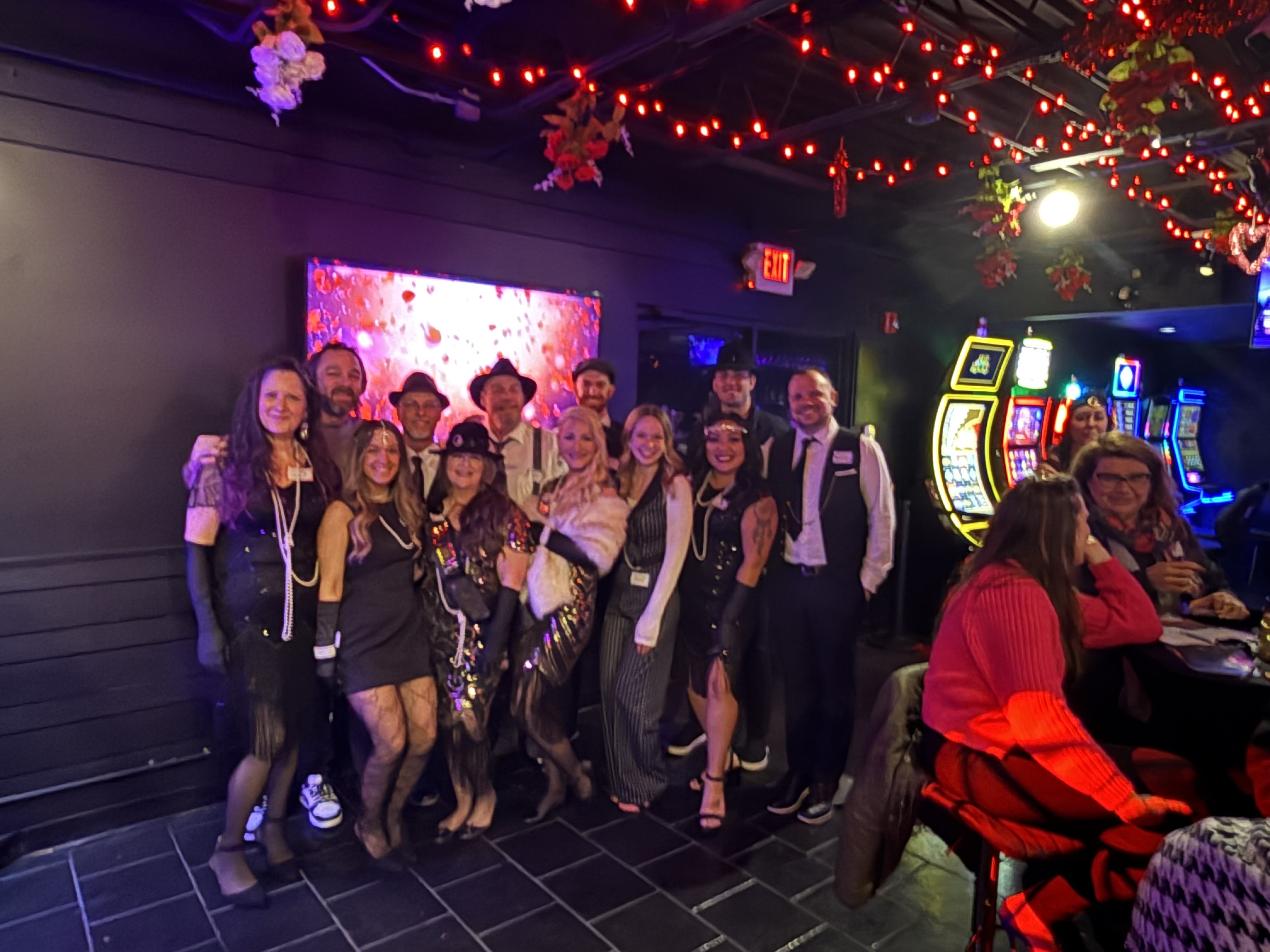 Group photo by the gaming machines
