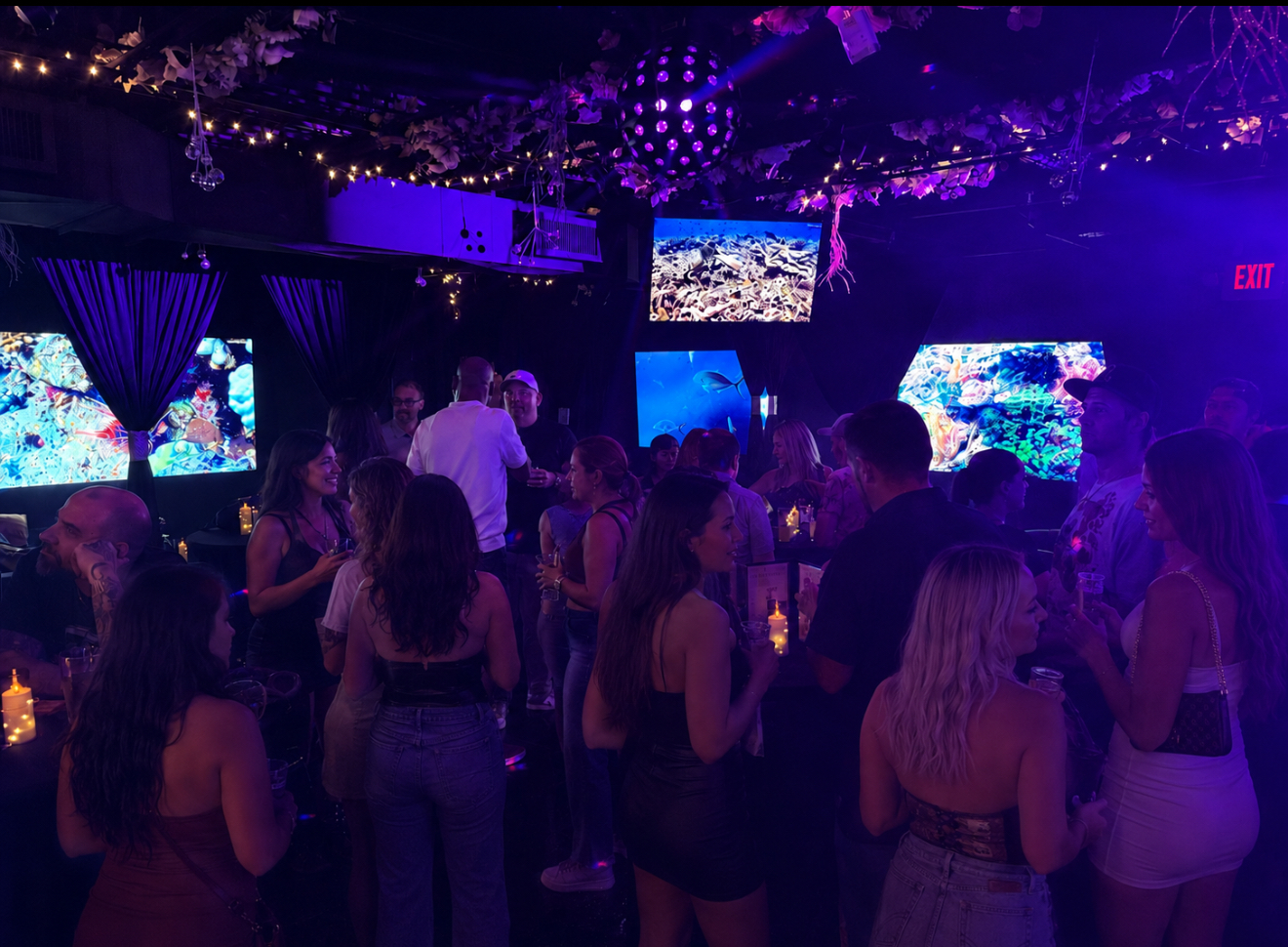 Guests enjoying the dance floor at Black Velvet Lounge