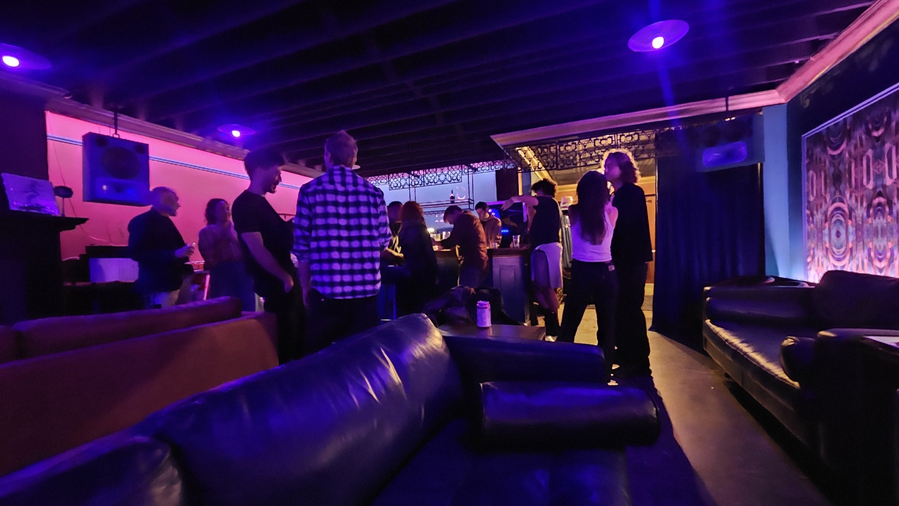 Guests standing and talking in the lounge