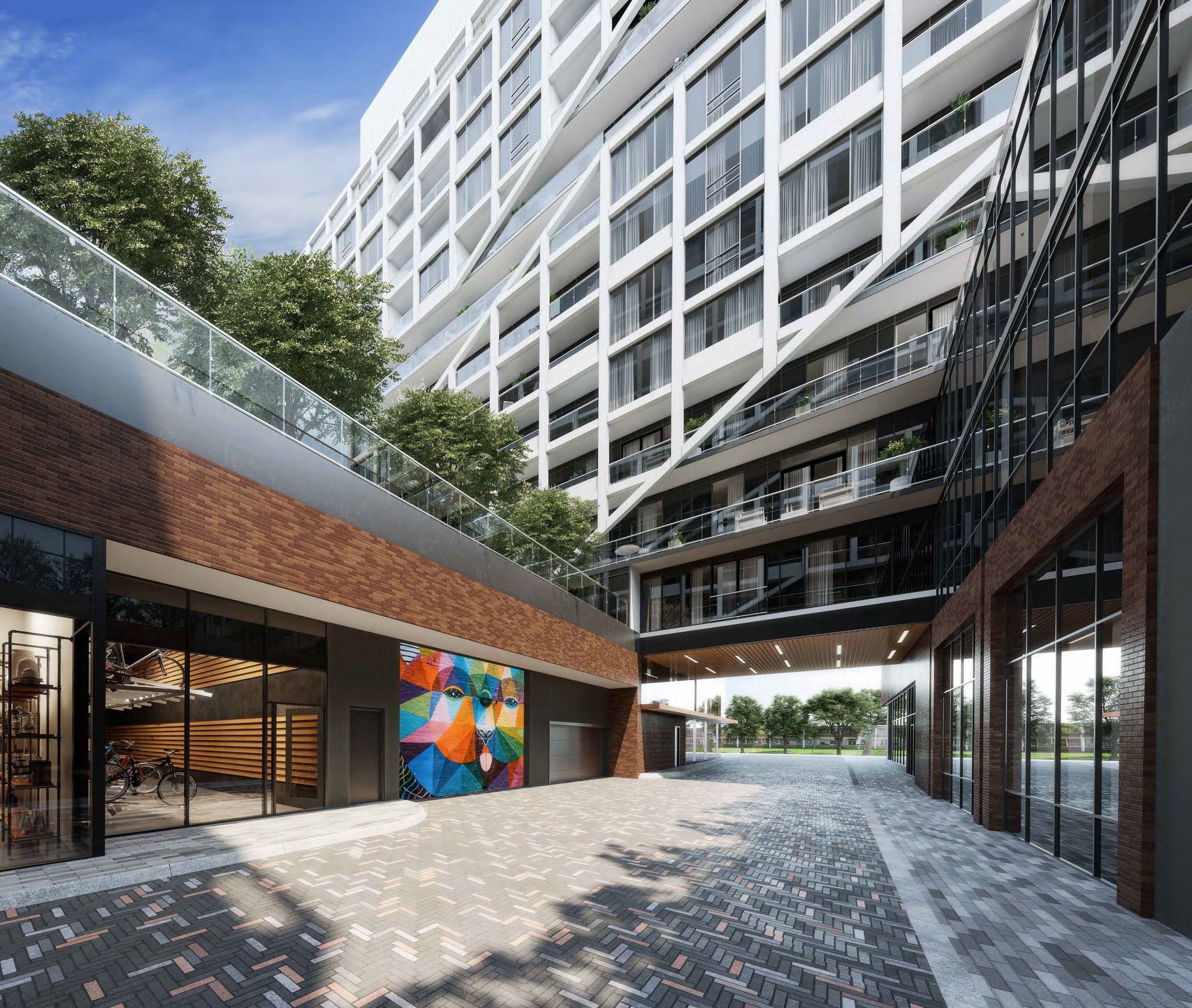 Modern residential building featuring a breezeway with brick accents, colorful wall mural, and geometric white facade above.