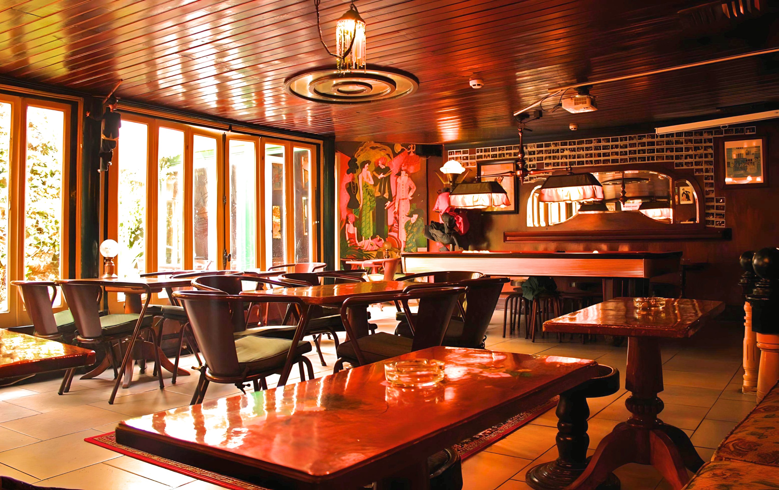 Foxtrot Lisbon intimate bar interior with vintage decor, warm lighting, and eclectic crowd