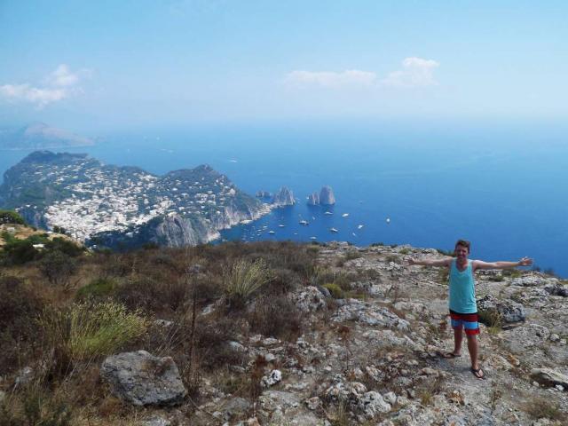 Teen traveler admires view from Capri Italy during summer youth tour