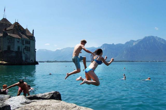 Teens jump into Swiss lake during summer travel adventure program