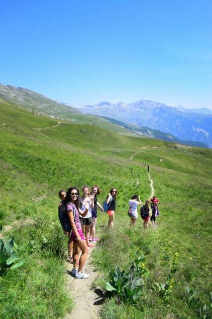 Teens hike through Swiss Alps on summer adventure travel program