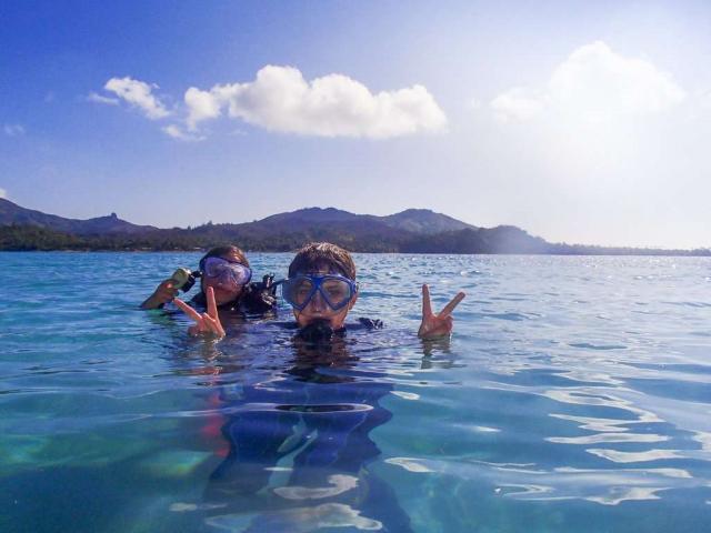 High school travelers dive into the ocean on their summer teen tour to the Land Down Under.