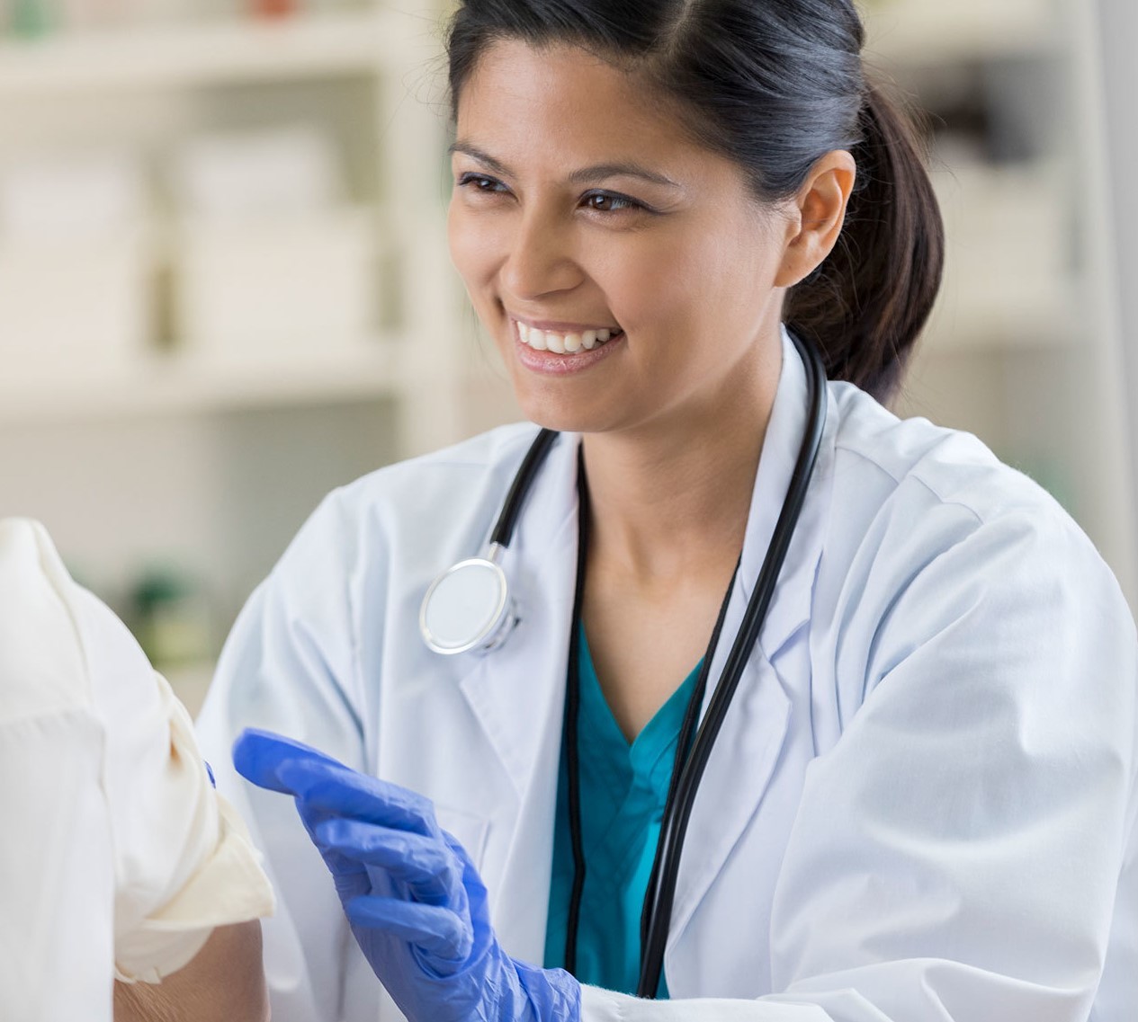 Doctor smiling while providing care