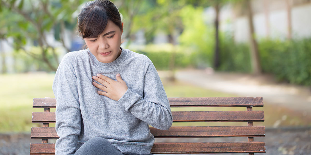 Woman holding chest