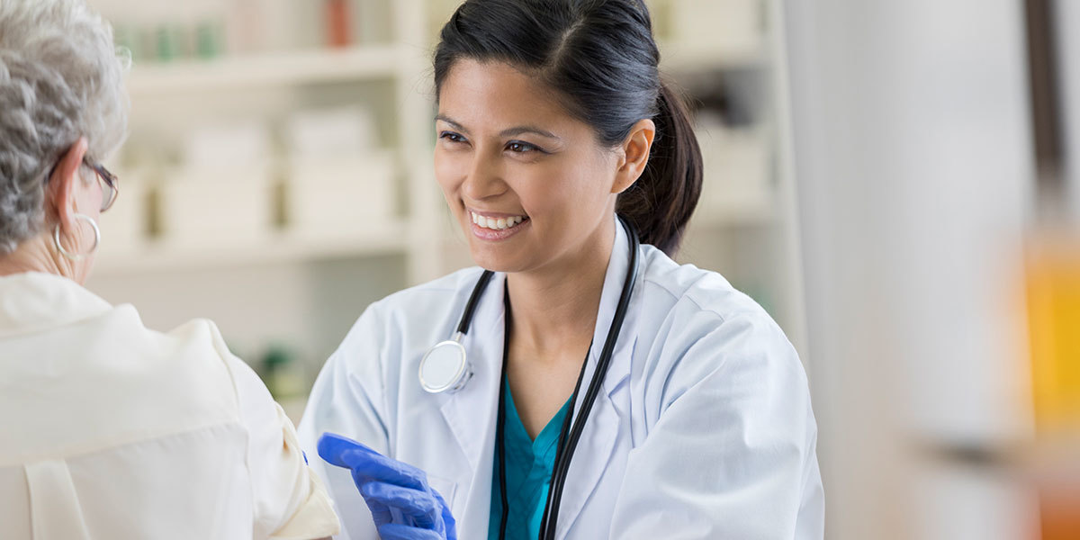 Doctor smiling while providing care