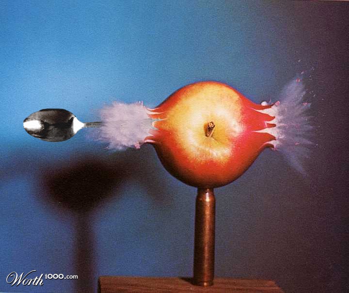 Spoon Going Through Apple