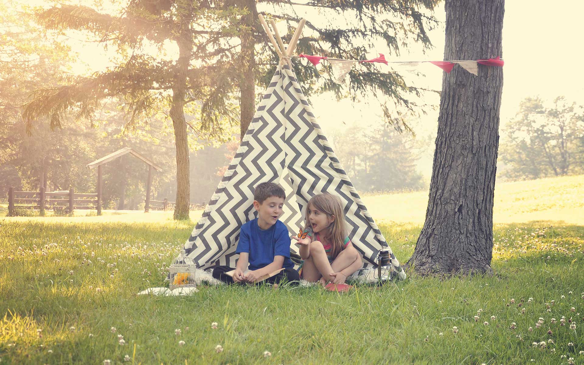 two-kids-sitting-in-tent-summertime1