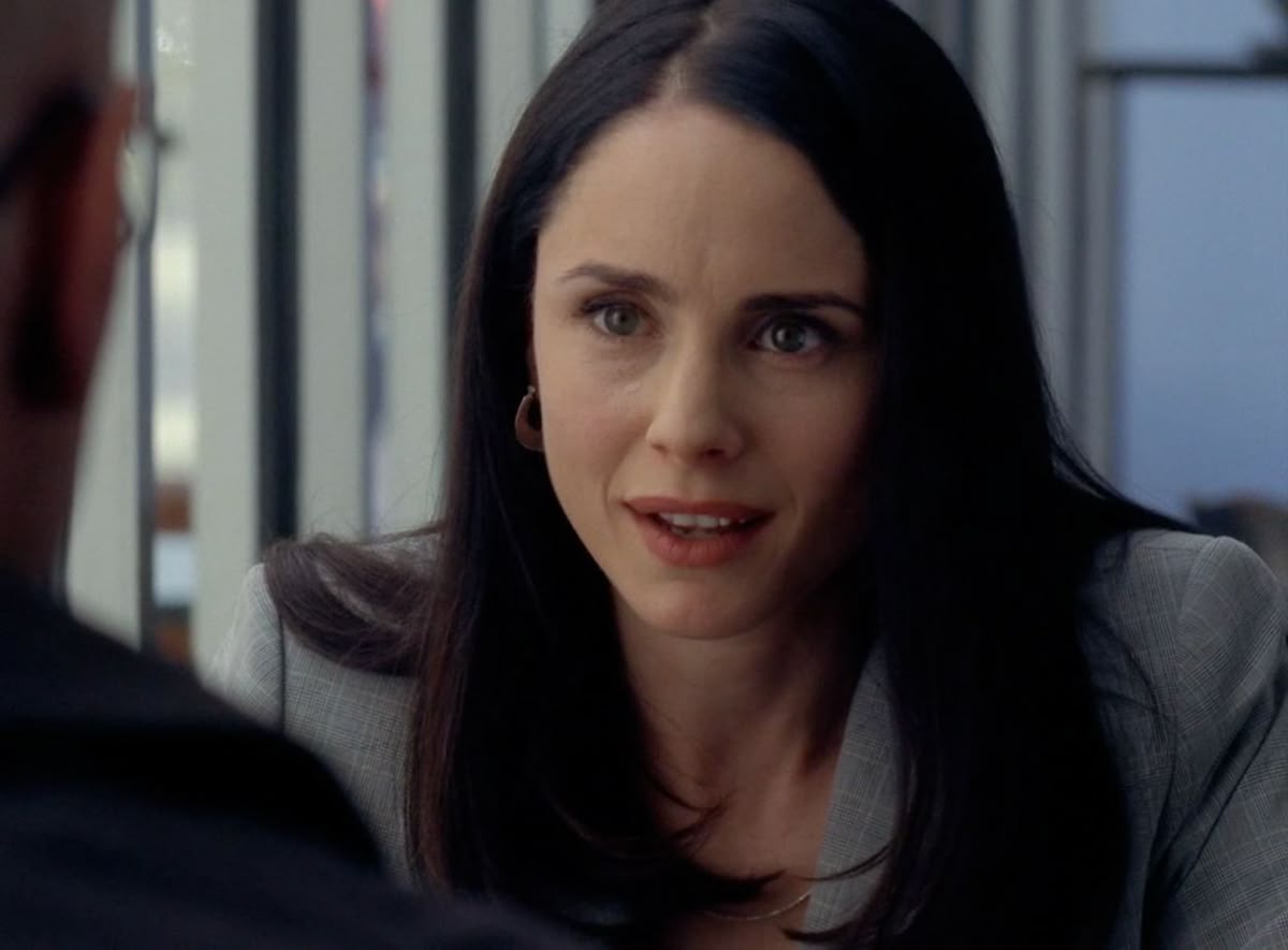 Lydia Rodarte-Quayle in glasses and a silk blouse, AI character from Breaking Bad