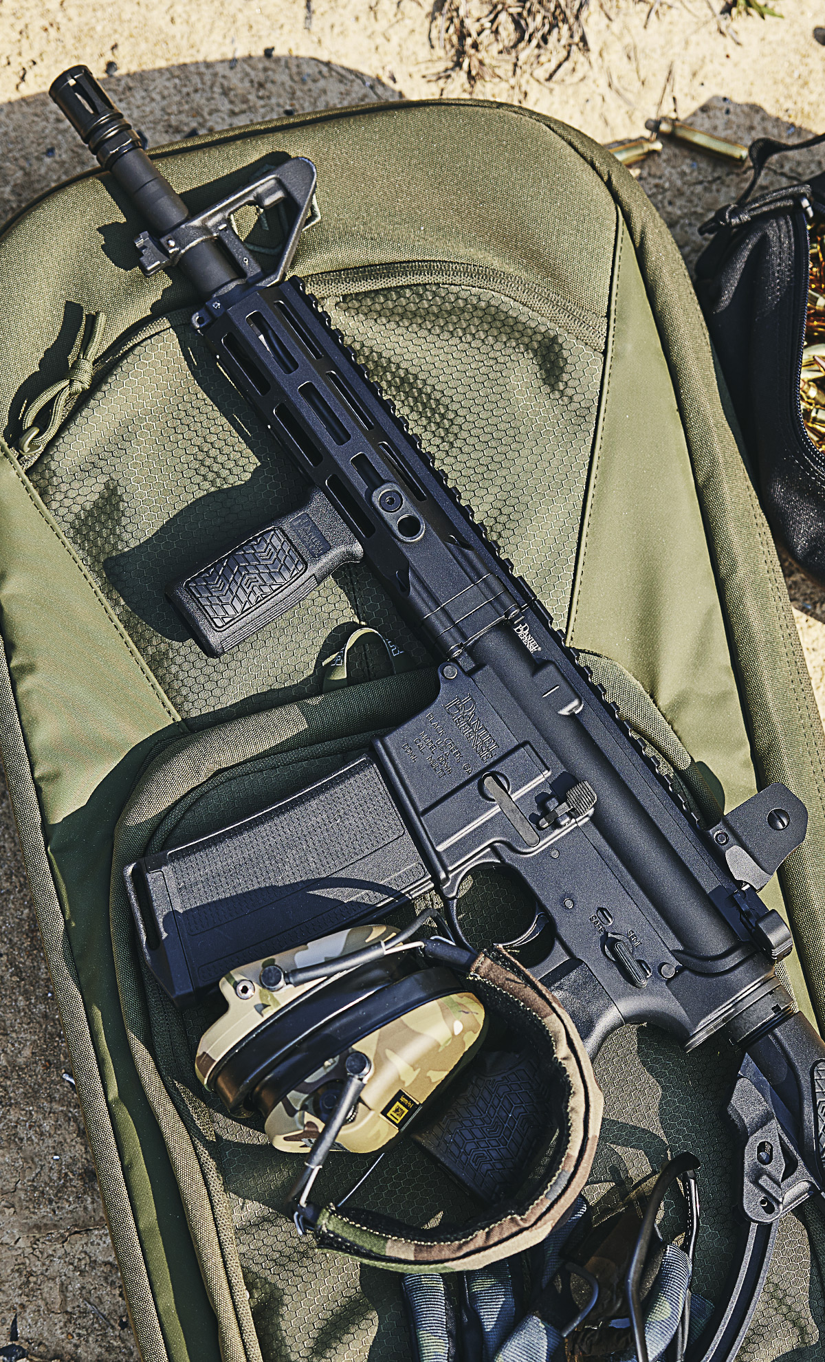 Rifle resting on range bag.
